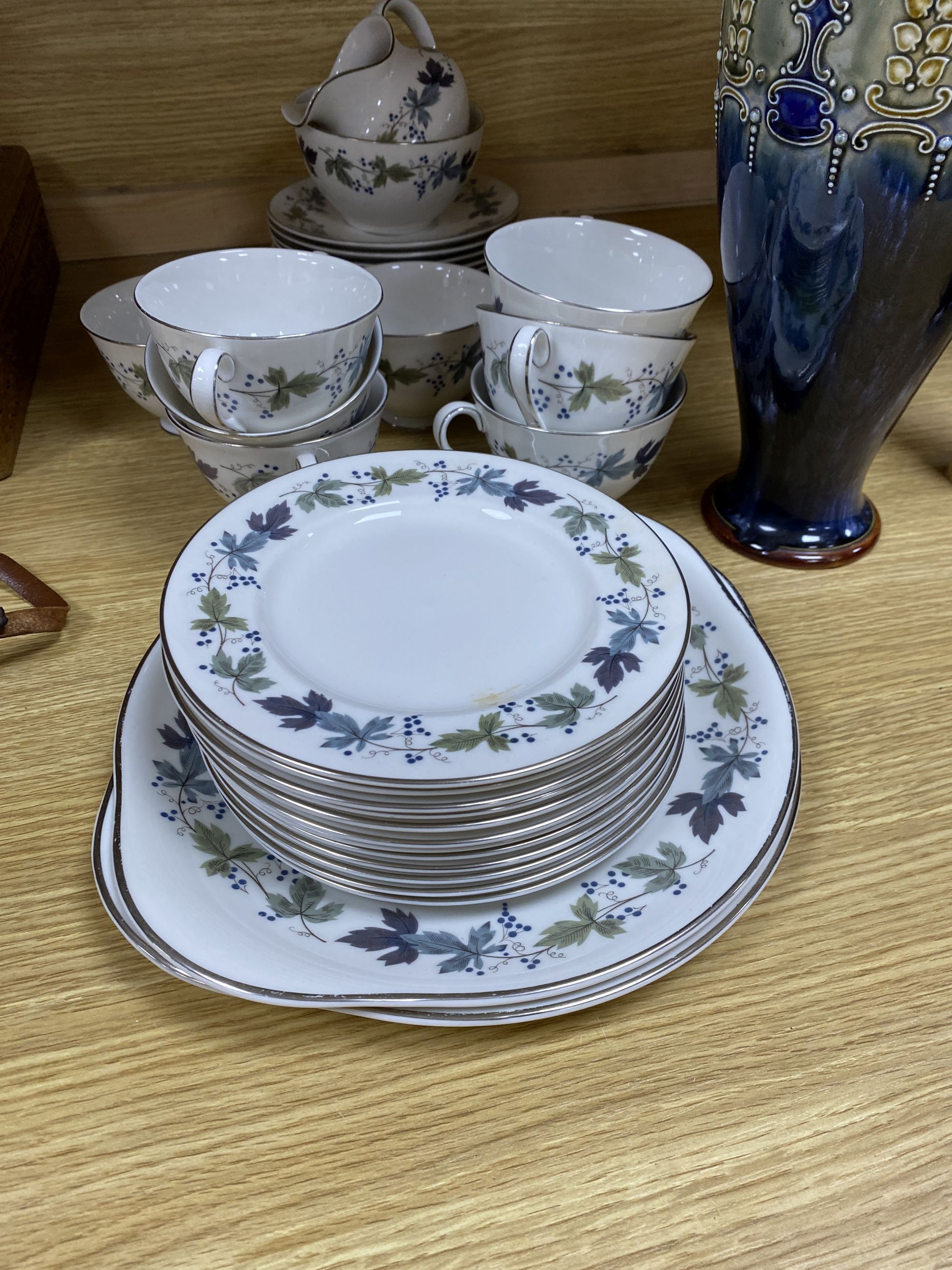 A Royal Doulton Burgundy pattern tea cups and saucers and a Doulton stoneware vase